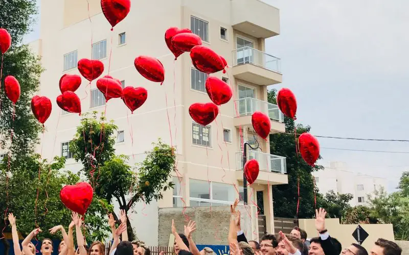 People releasing balloons.